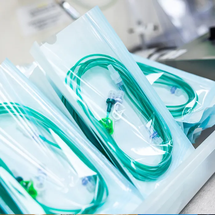 Sterile medical devices sealed in transparent silicon-free pouches